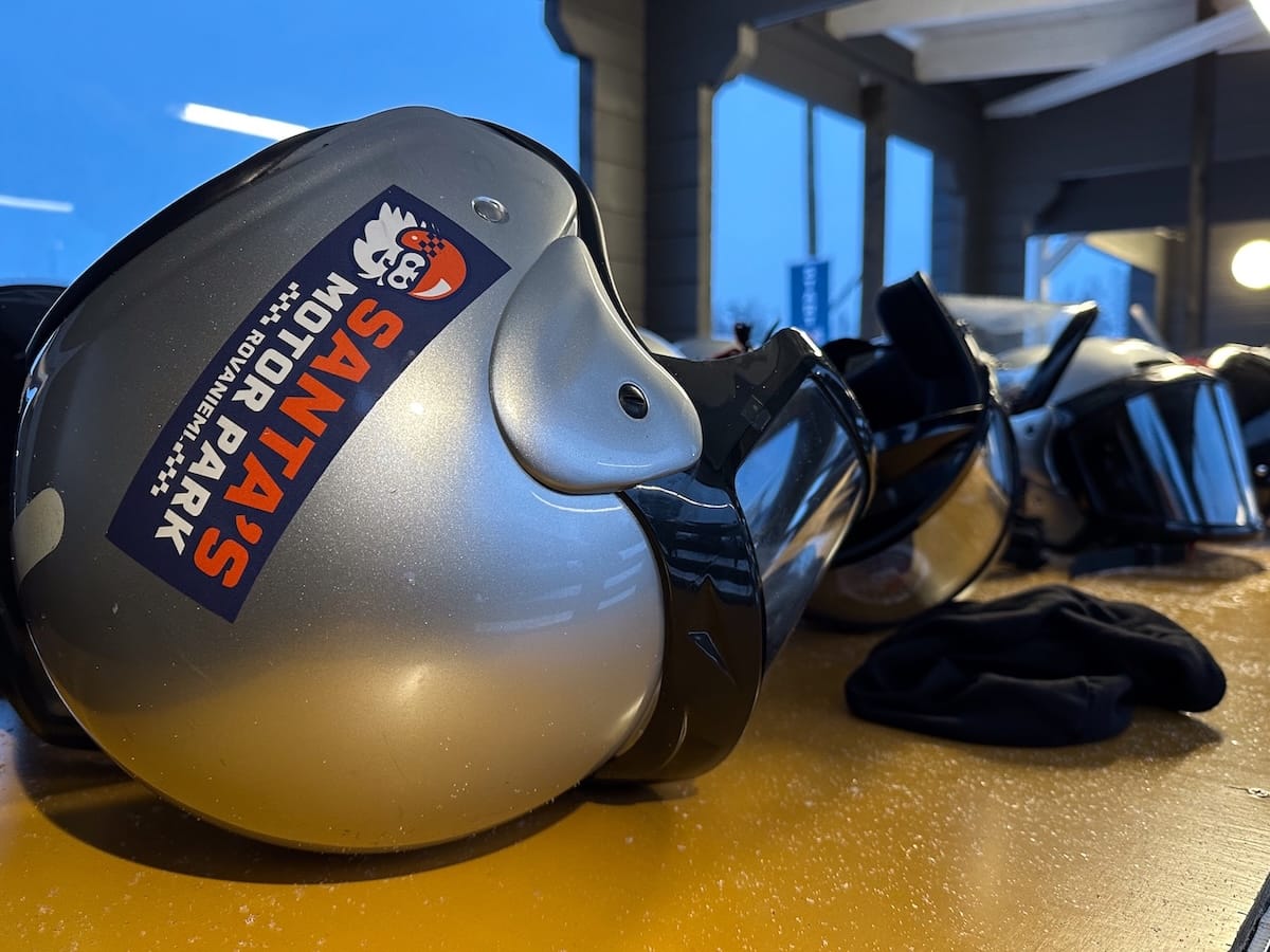 Ice karting in Rovaniemi | Santa's Motor Park
Helmets sitting on a table with Santa's Motor Park stickers on them.
