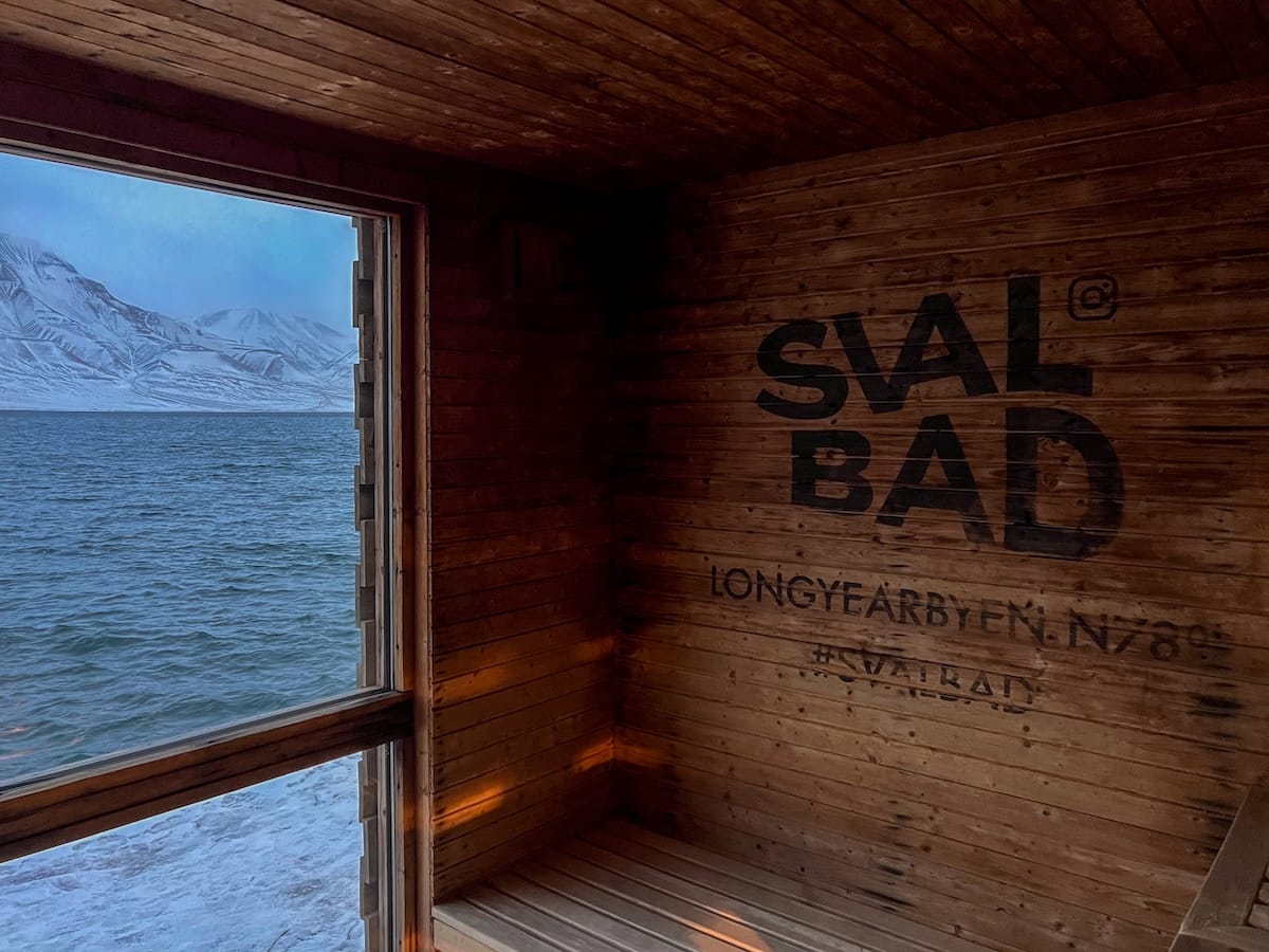 Visiting Svalbad Sauna in Svalbard
____
inside a wooden sauna with views through a window of the sea
