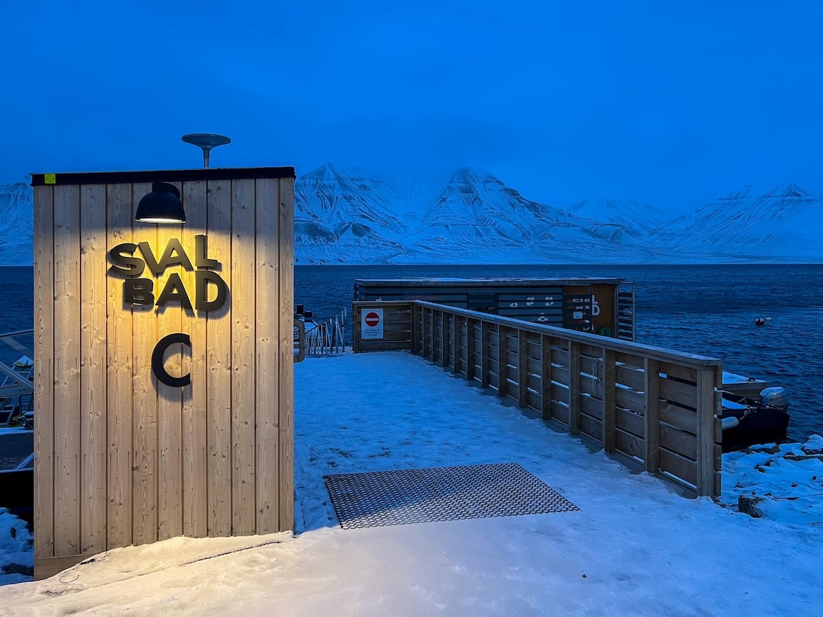 Visiting Svalbad Sauna in Svalbard
____
dark blue skies with a wooden sauna in the background