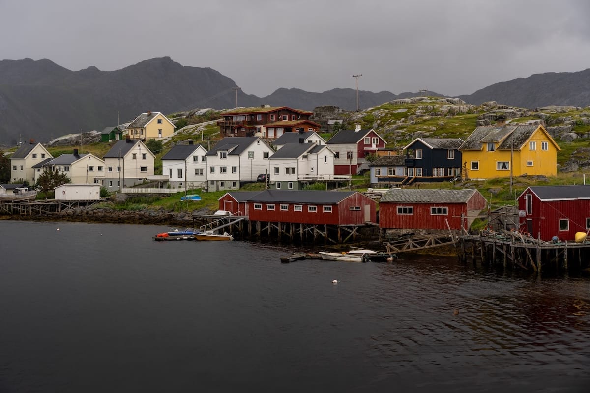 Where to Stay at the North Cape in Norway (+ Honningsvåg)
a fishing village by the sea with a lot of wooden, colorful buildings