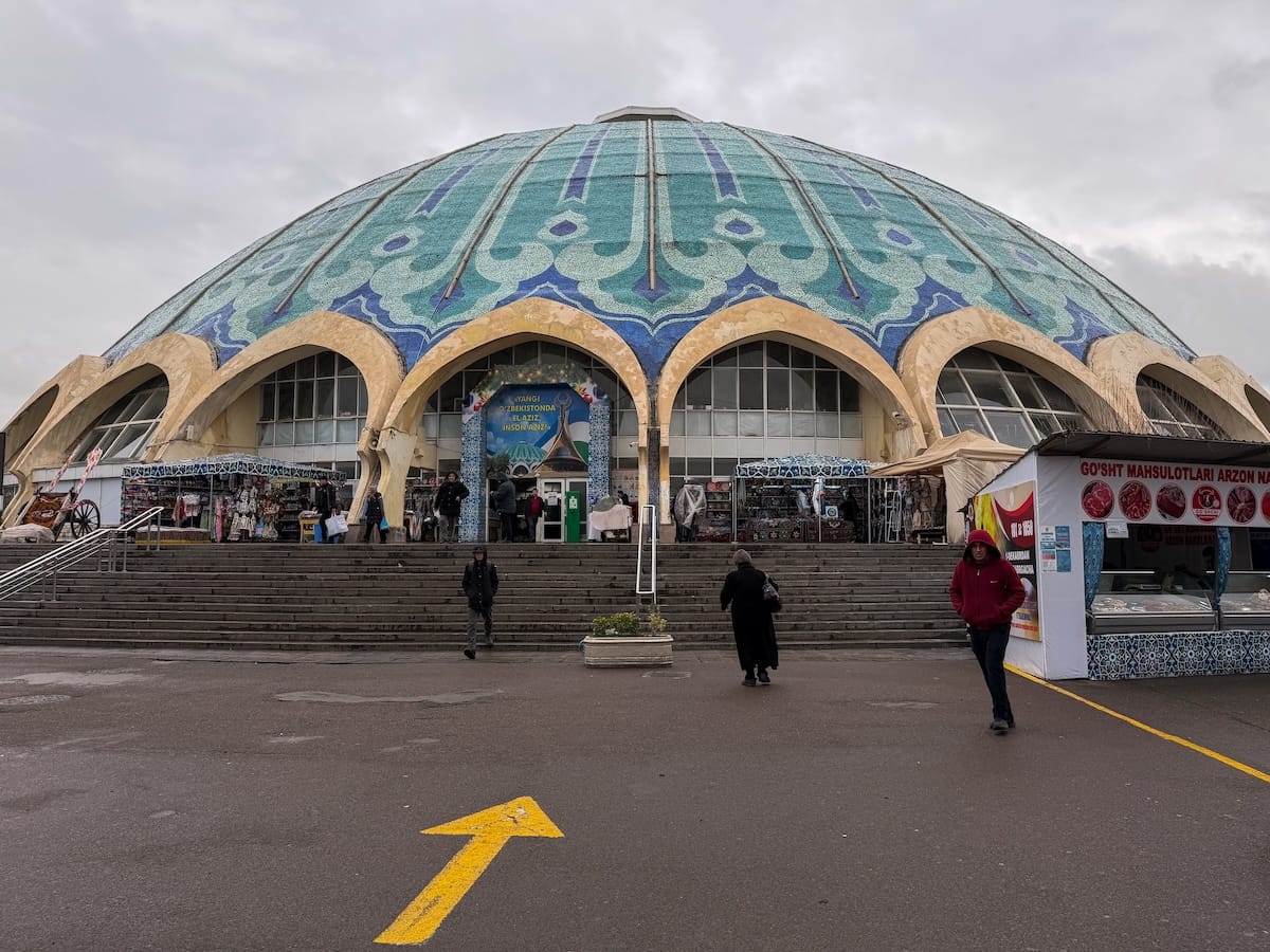 a circular building in tashkent with a teal roof