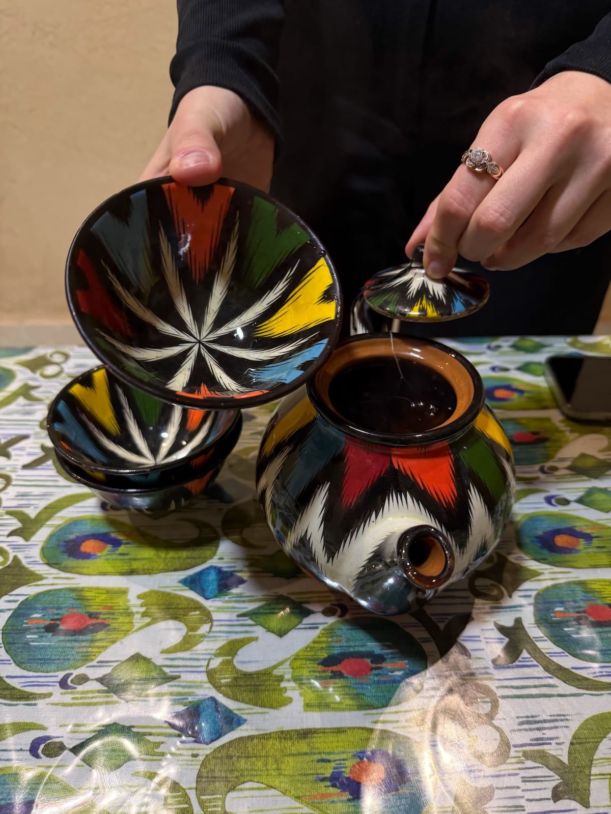a colorful tea mug and glasses