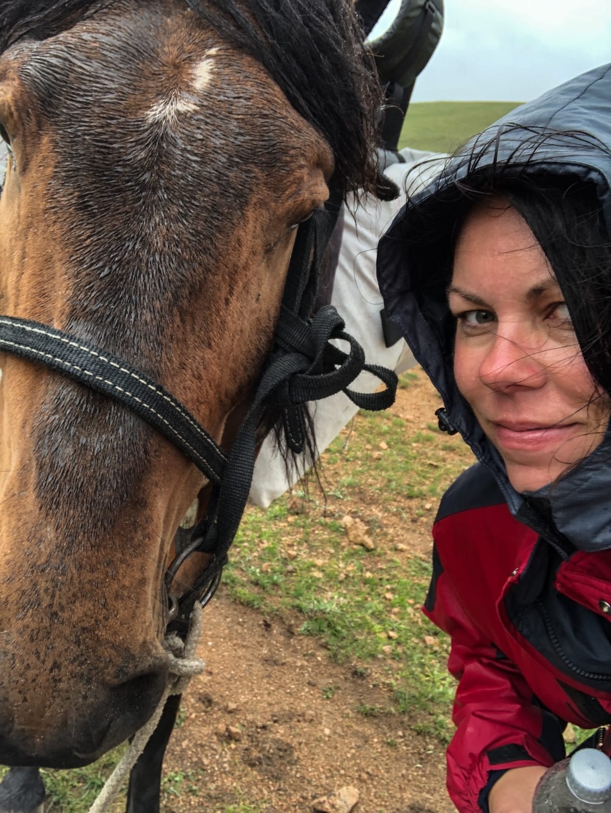 a woman and a horse in central asia