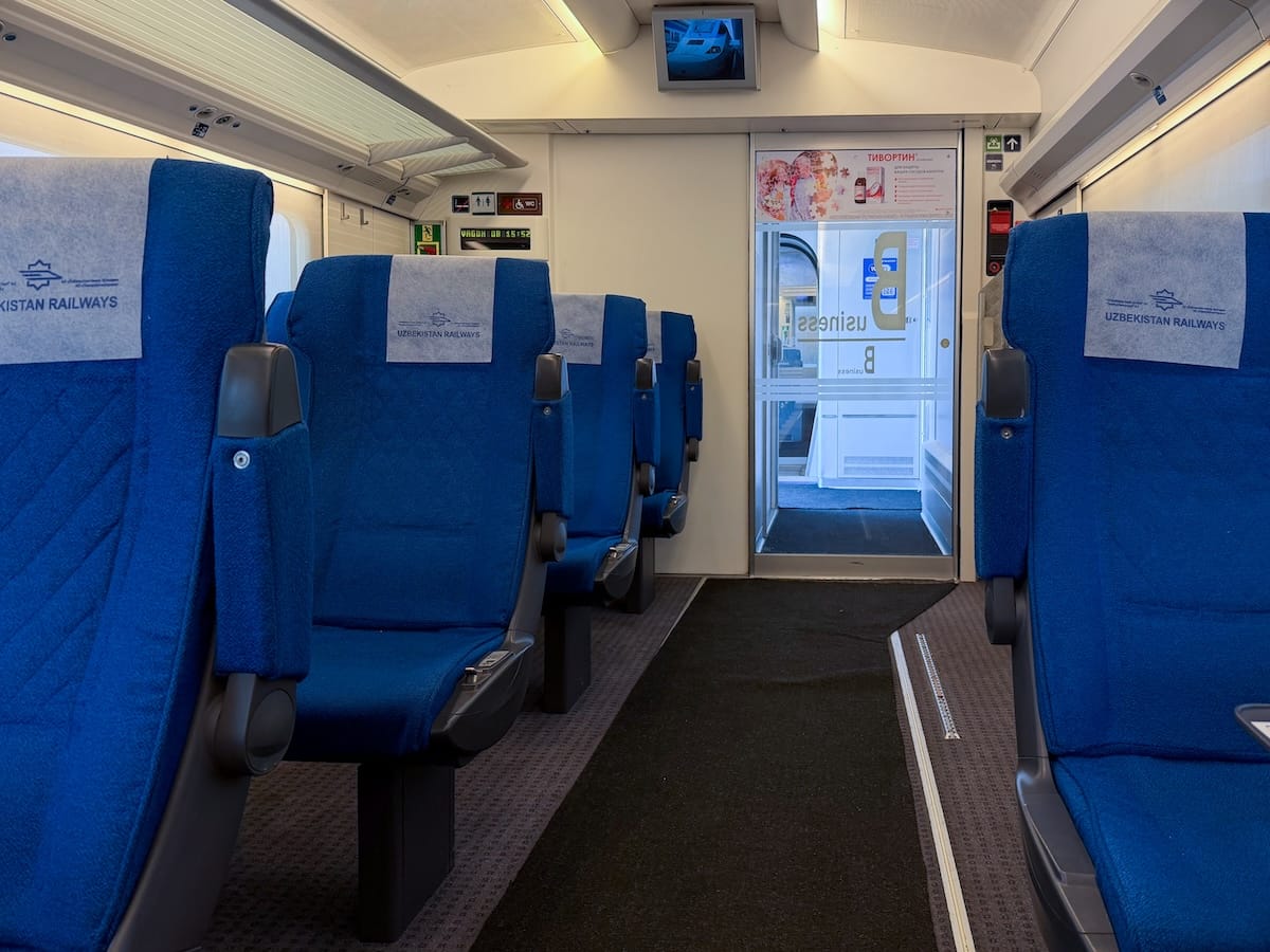 inside a train with blue seats
