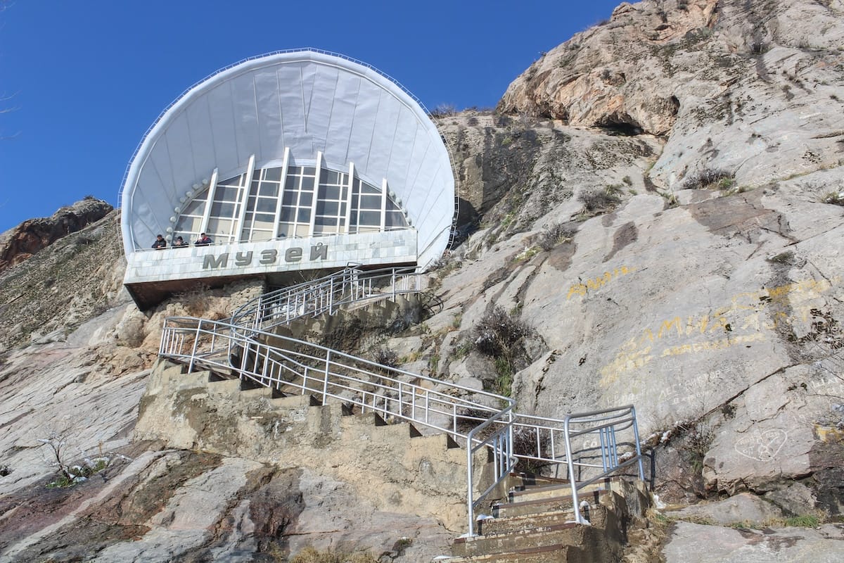 a picture of a museum built into a rocky mountain