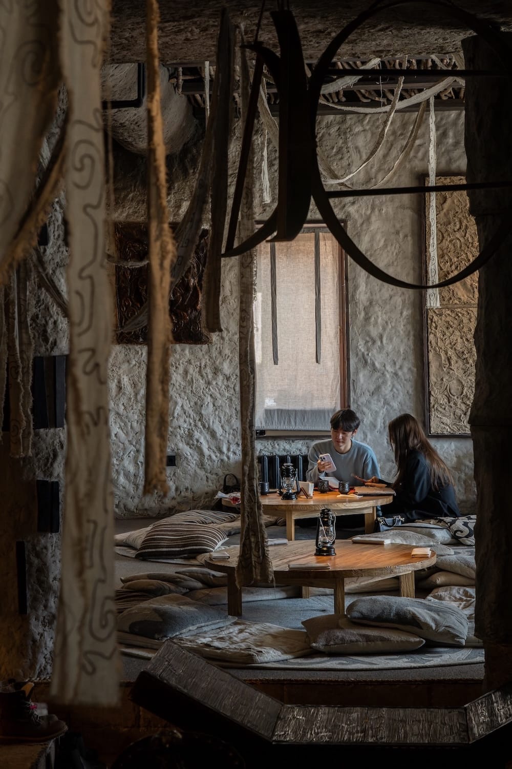 Two people sitting at a table (dastarkhan) at a restaurant in Kazakhstan