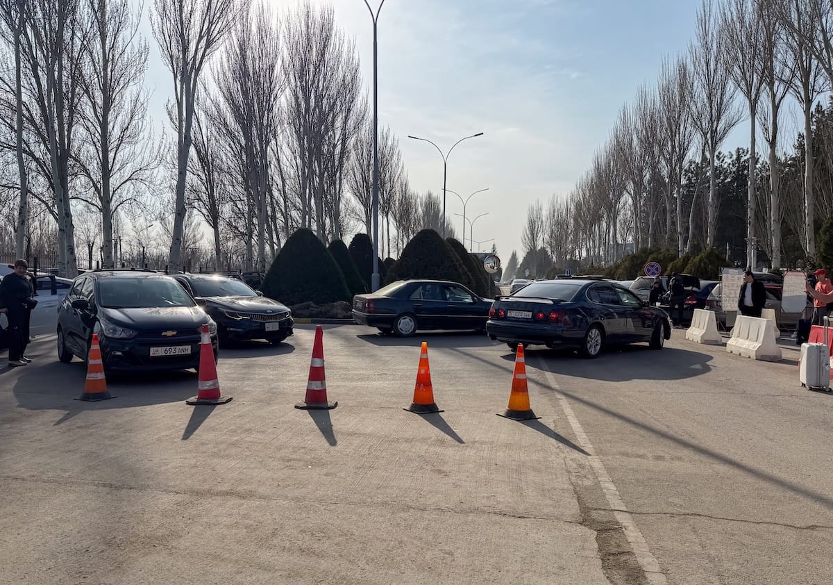 a bunch of taxis and traffic cones