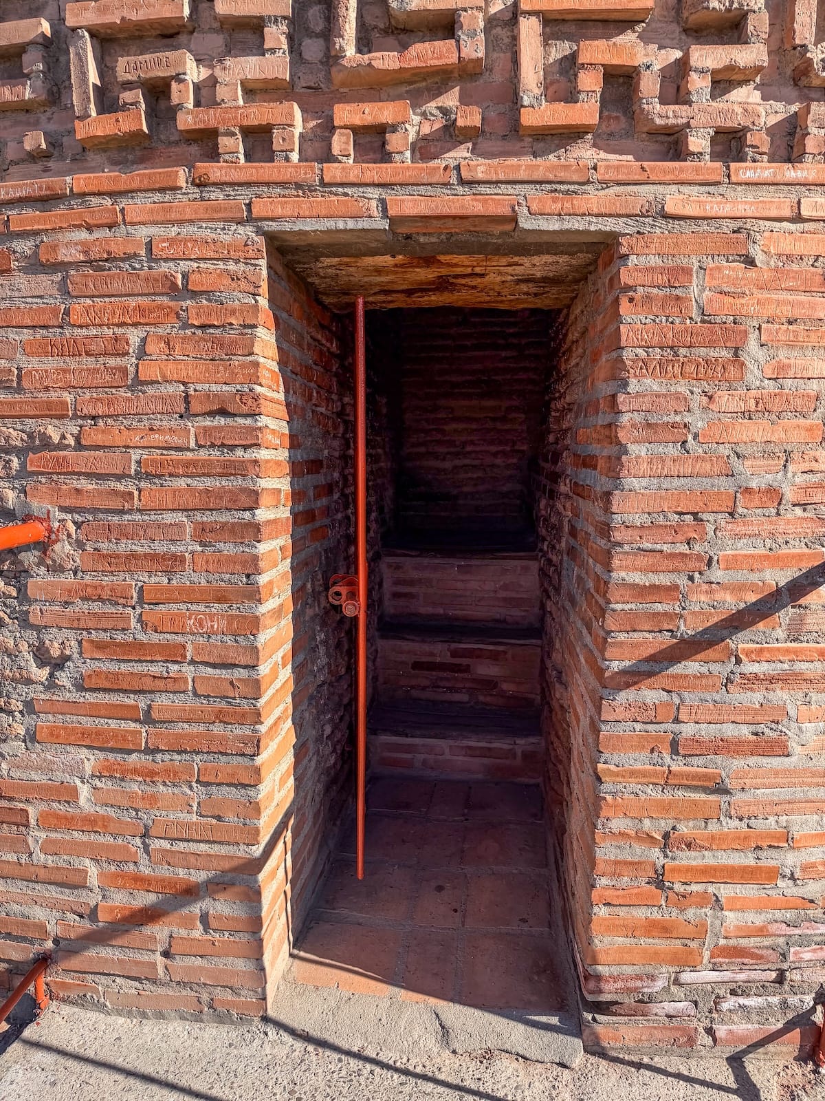 a view of a narrow staircase and entrance to a tower