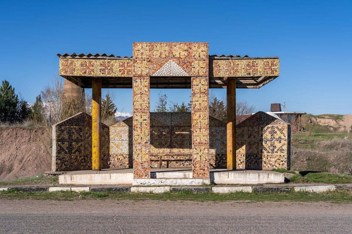 a mosaic bus stop in a village