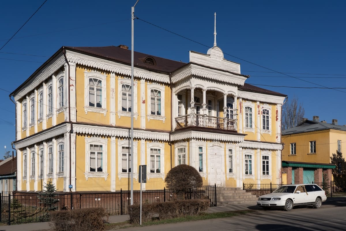 a yellow Russian colonial style building in central asia