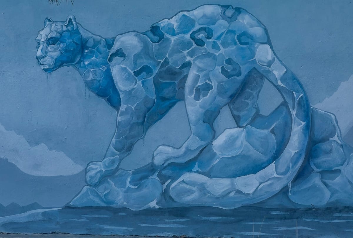 street art mural of a snow leopard