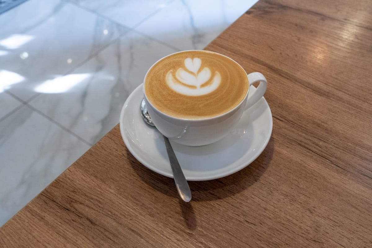 a coffee with latte art on a table