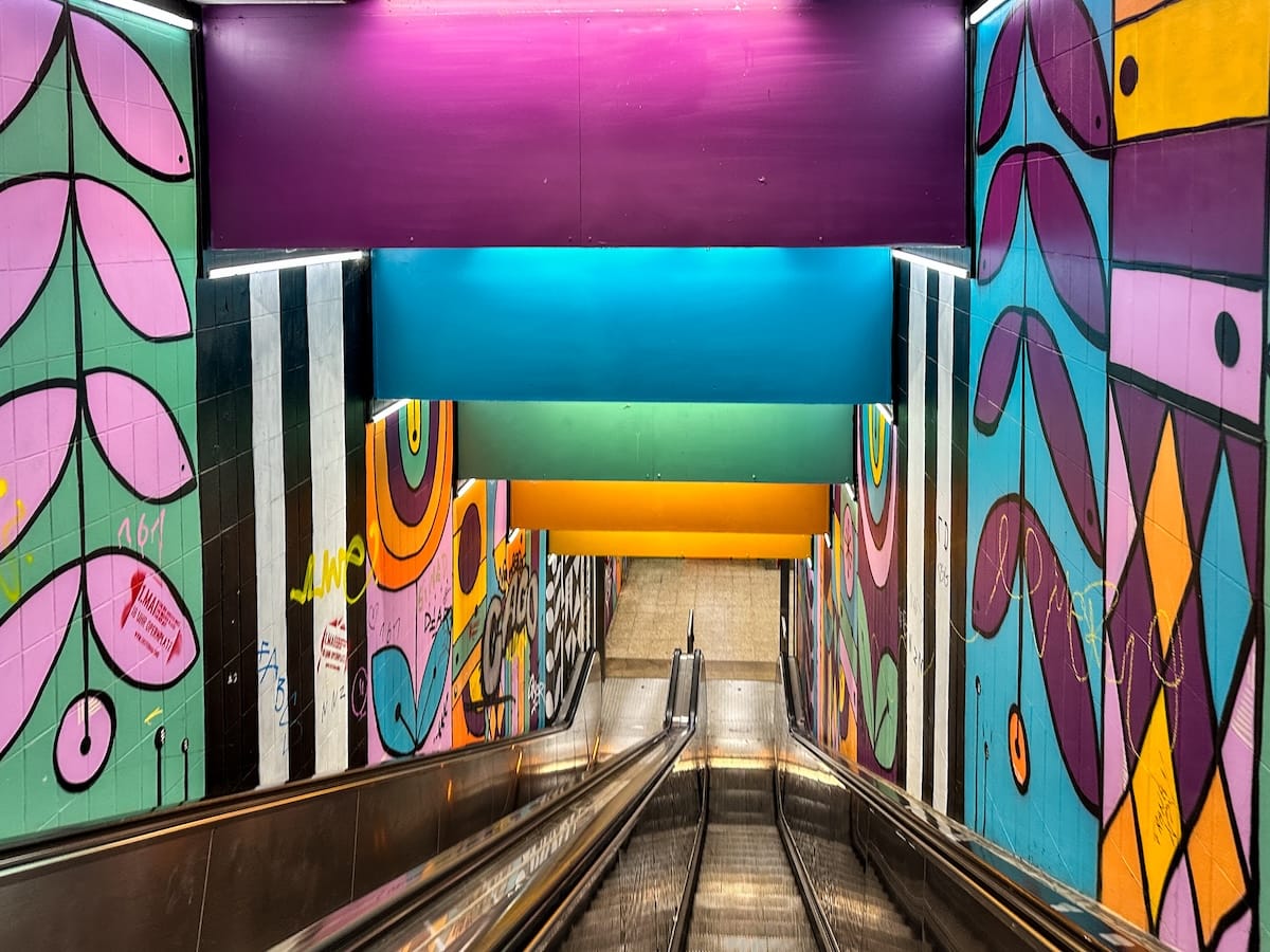 an underground metro with colorful wall art