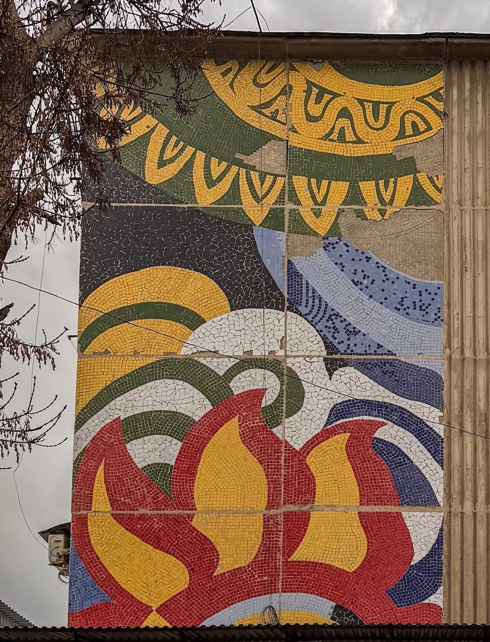a colorful mosaic on the side of a building