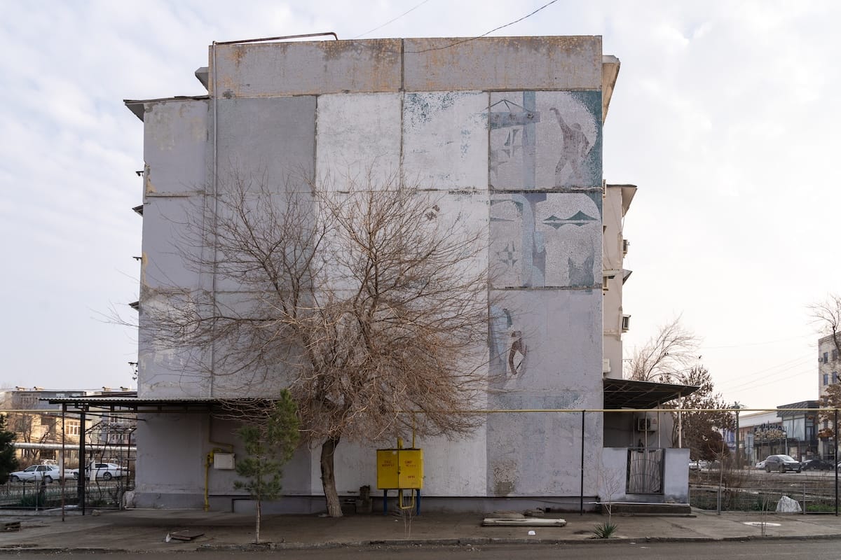 a mosaic that was covered up by paint on a building