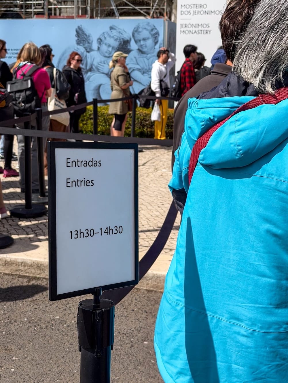 a sign indicating a time slot for a line on it