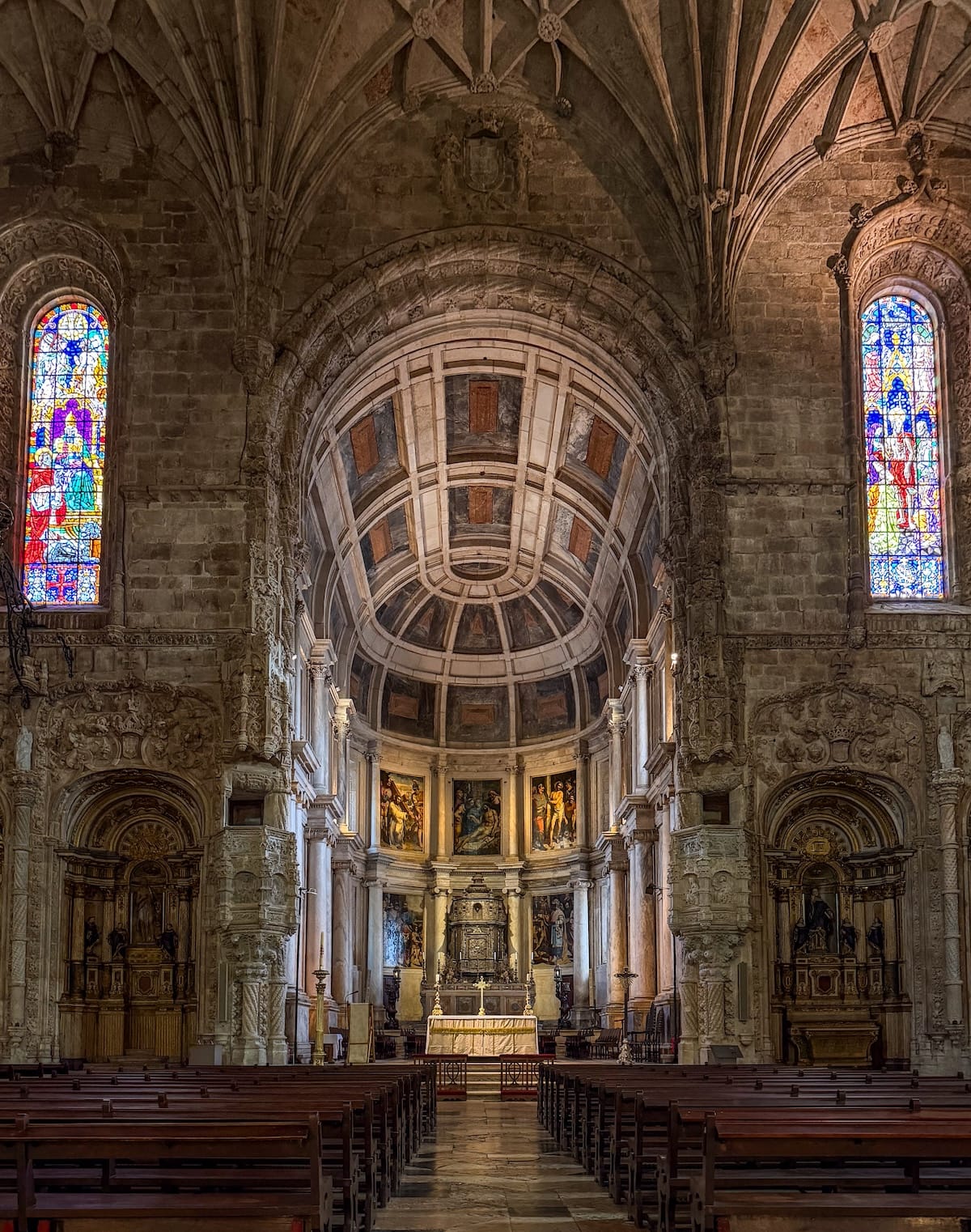 the inside of a church with stained glass windows