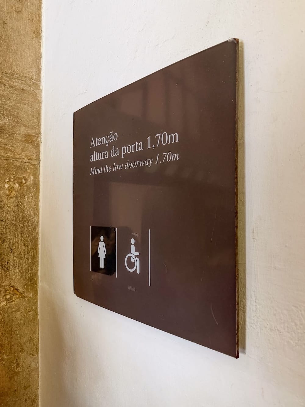 a sign showcasing an accessible bathroom