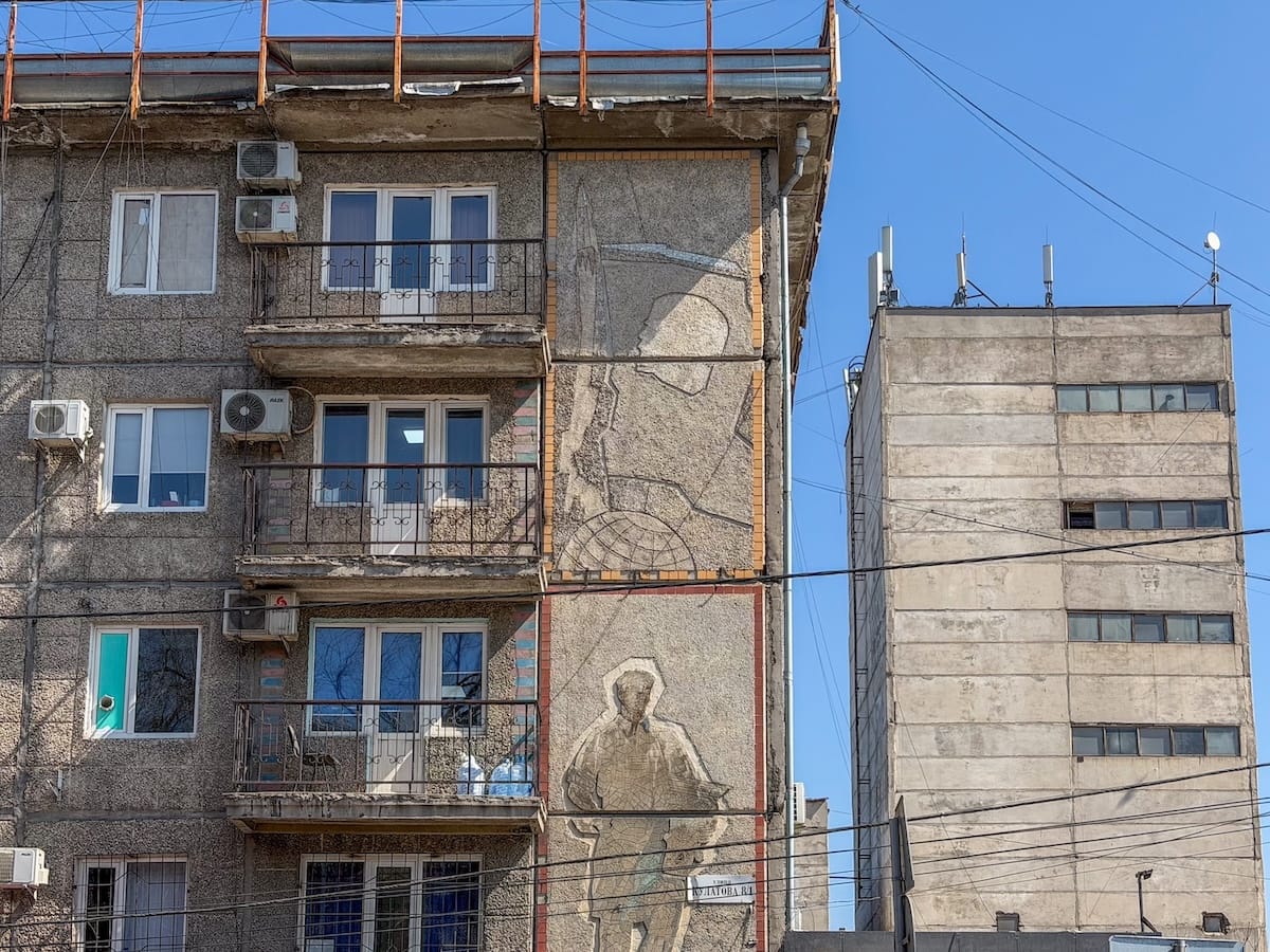 some sgraffiti on a building in bishkek