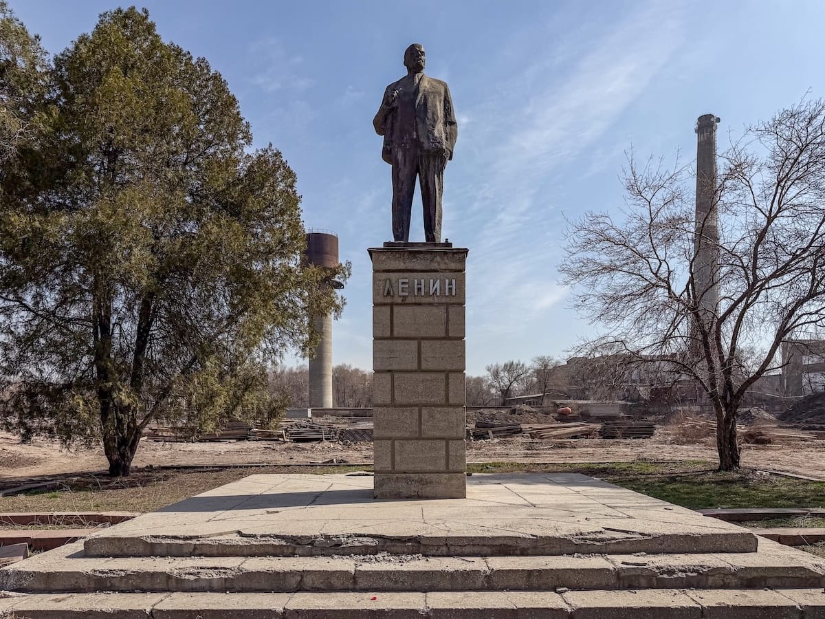a lenin statue in an industrial complex