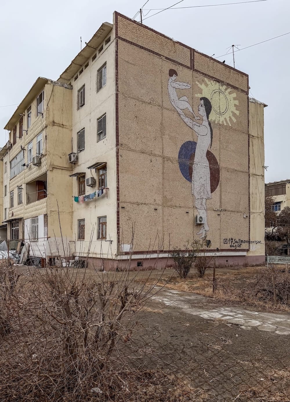 a mosaic of a mother and a child on a building