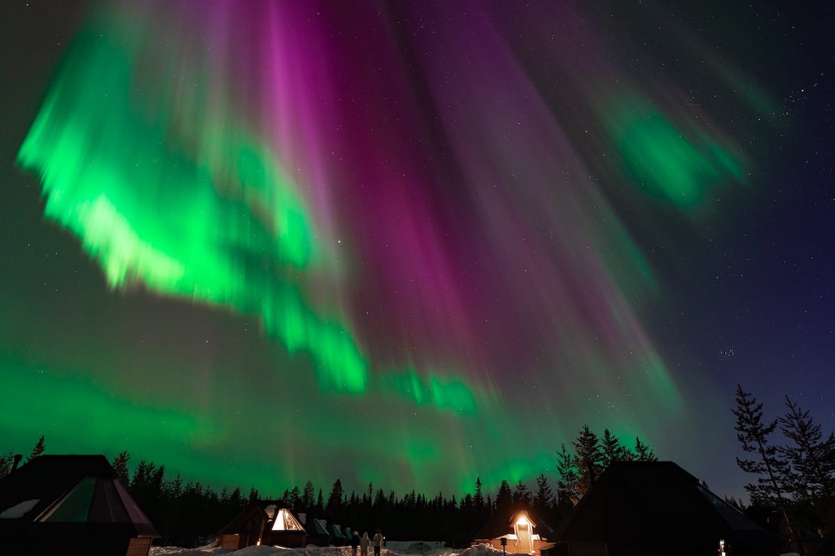 Glass igloo cabins under the northern lights