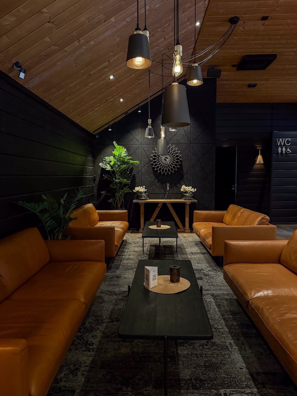 a reception area with couches and dim lighting