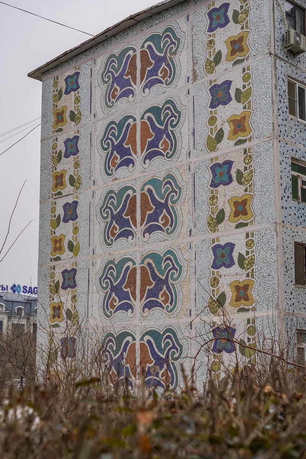 a colorful mosaic on the side of a building in uzbekistan