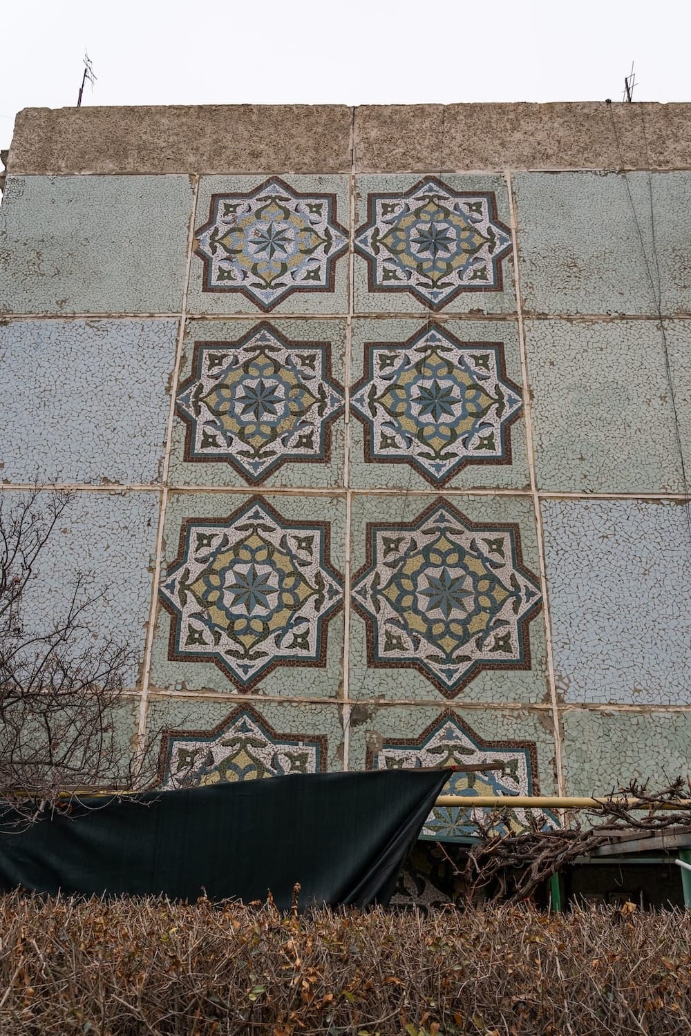 a colorful mosaic on the side of a building