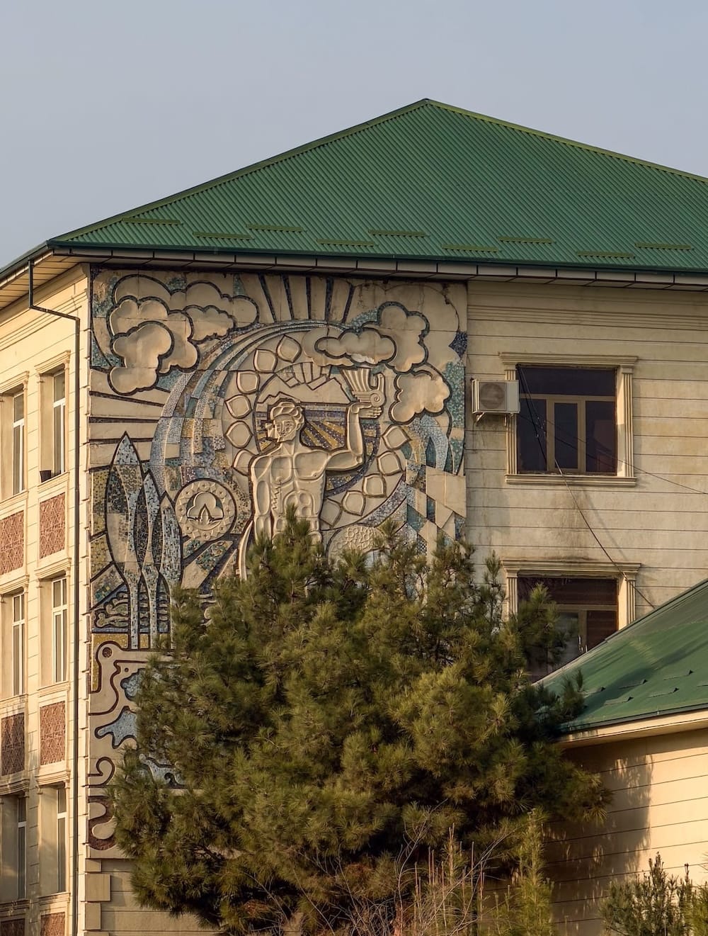 a mosaic-relief on the side of a building