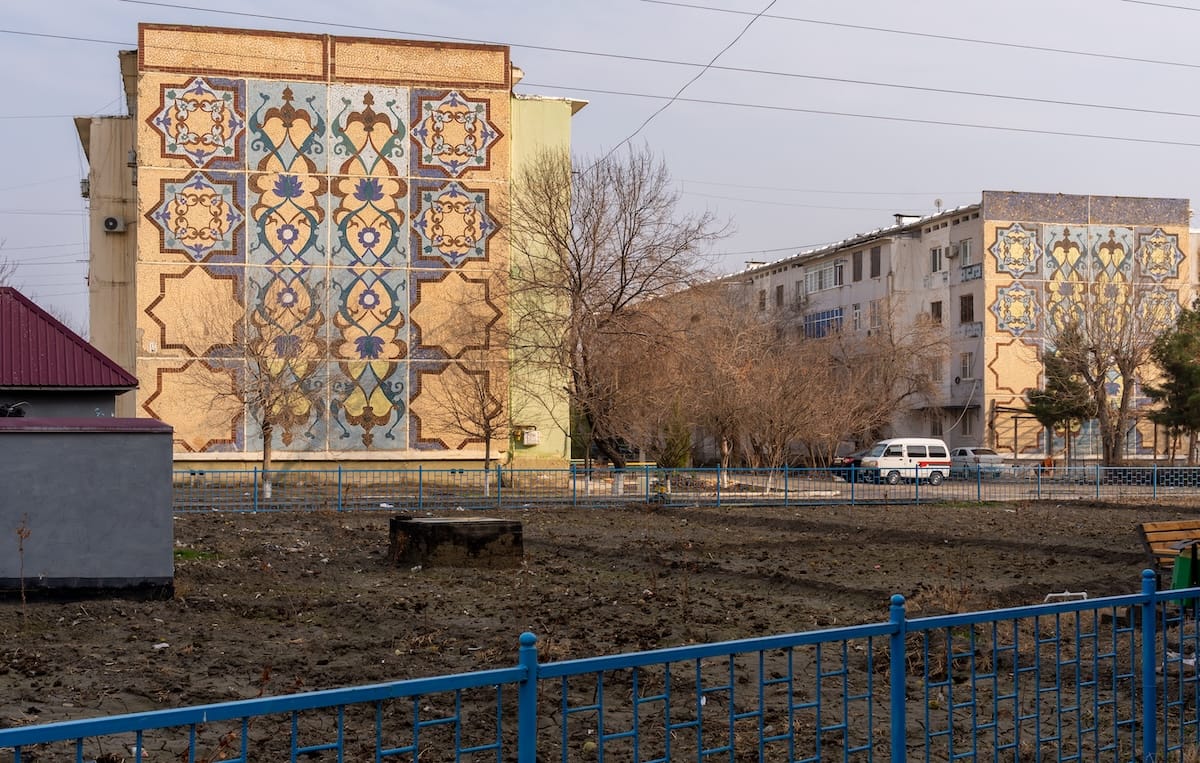 two buildings with mosaics on the sides of each
