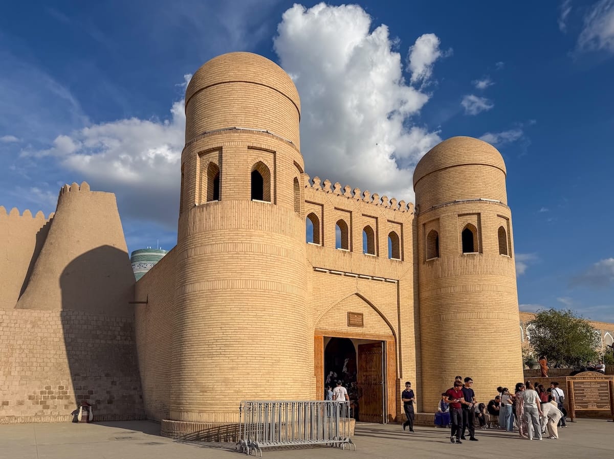 an elaborate gated entrance to an old town ; best things to do in khiva