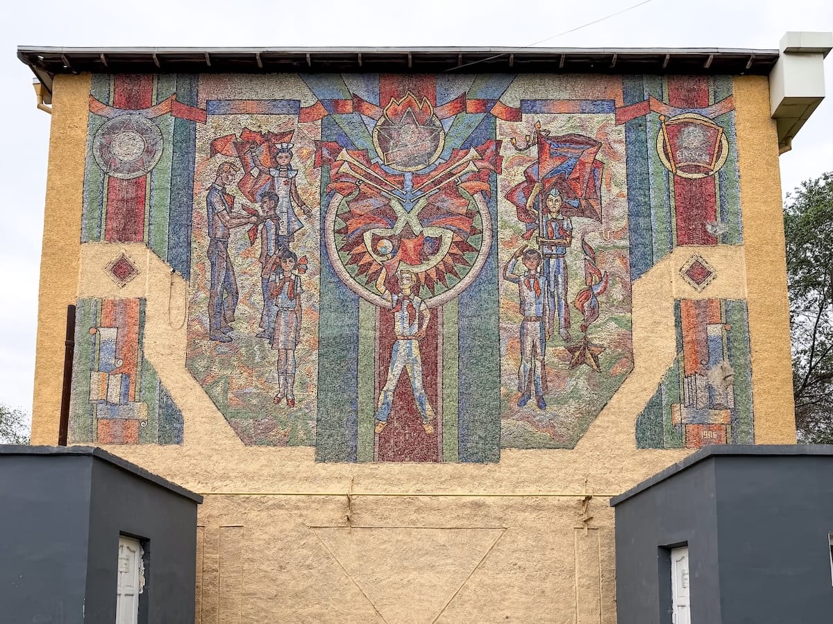 a photo of a soviet-era mosaic on a school facade