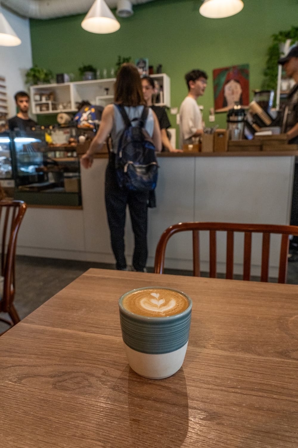 a flat white on a table in a cafe