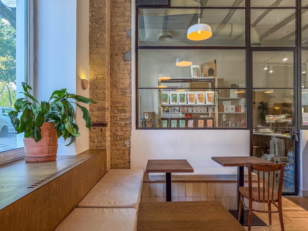 Coffee shops and cafes in Tashkent guide
a minimalistic cafe with a roastery behind a window