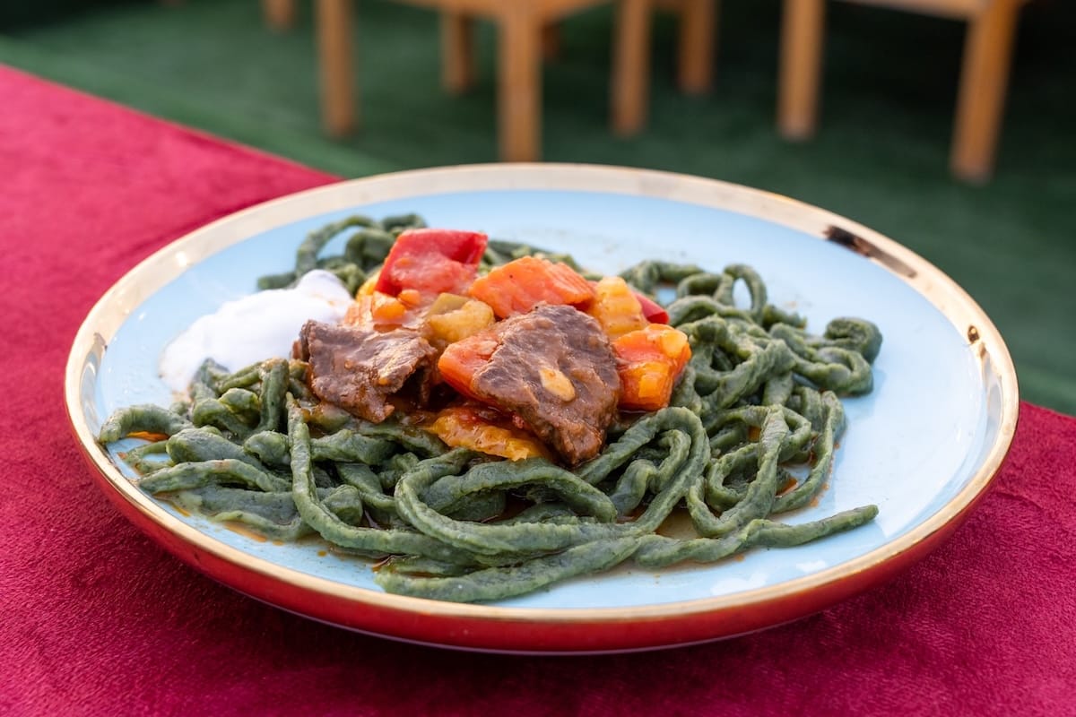 a plate of shivit osh (dill noodles) on a table