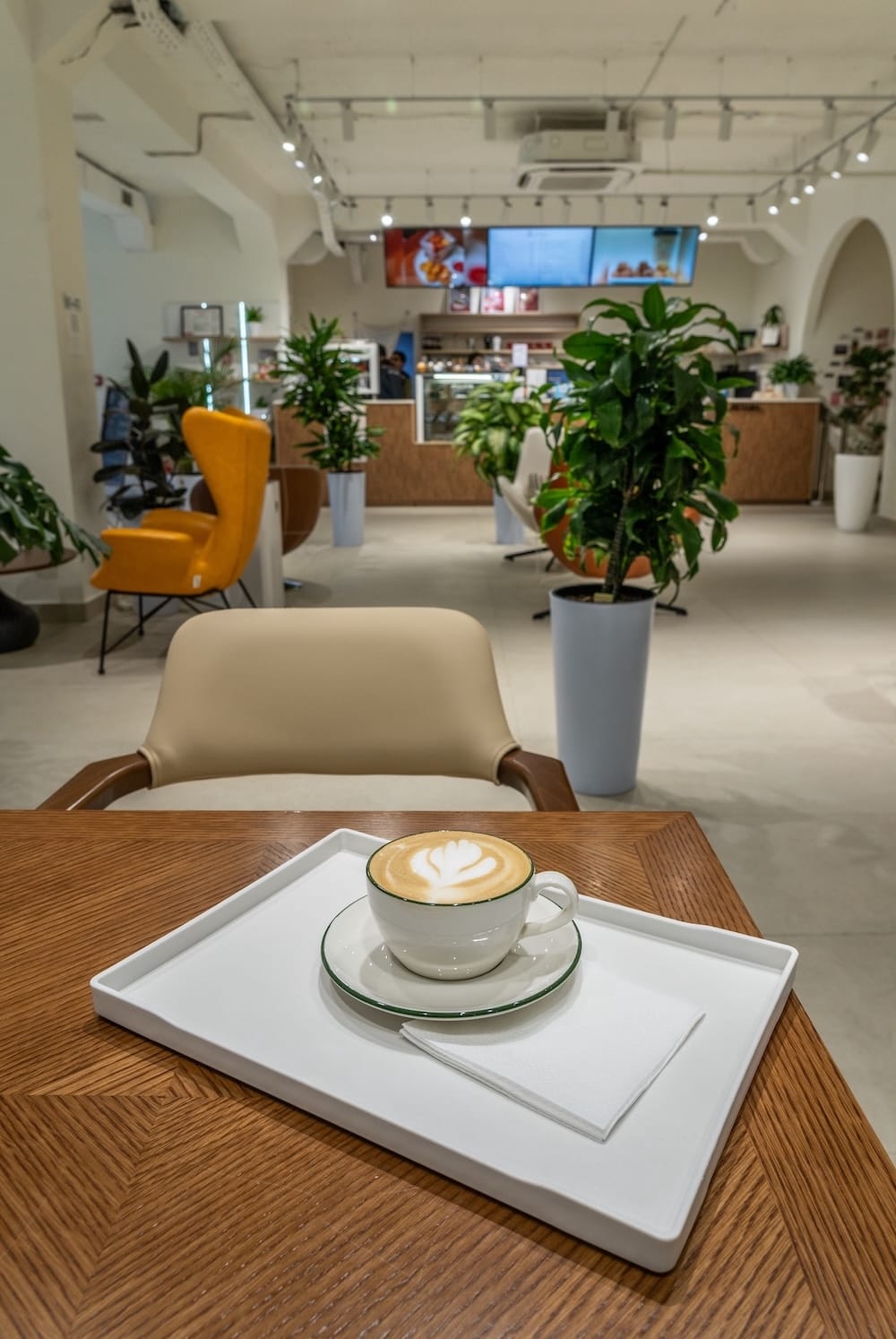 a coffee on a table in a cafe with bright interior