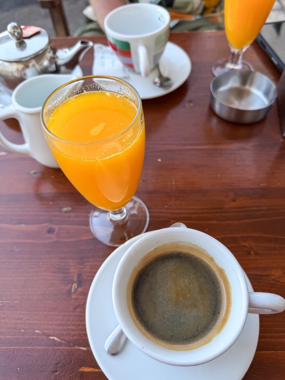 an americano coffee and orange juice at a cafe in spain