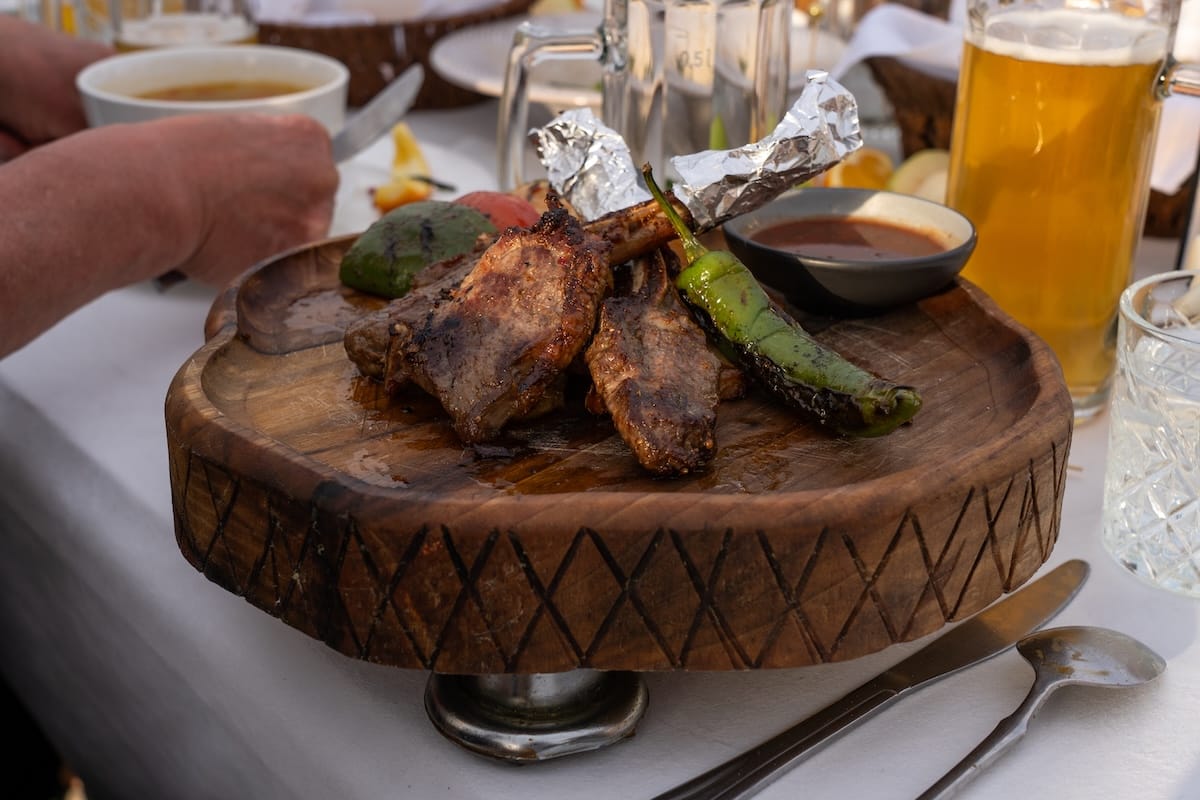 fried lamb and a chili pepper on a dish in uzbekistan