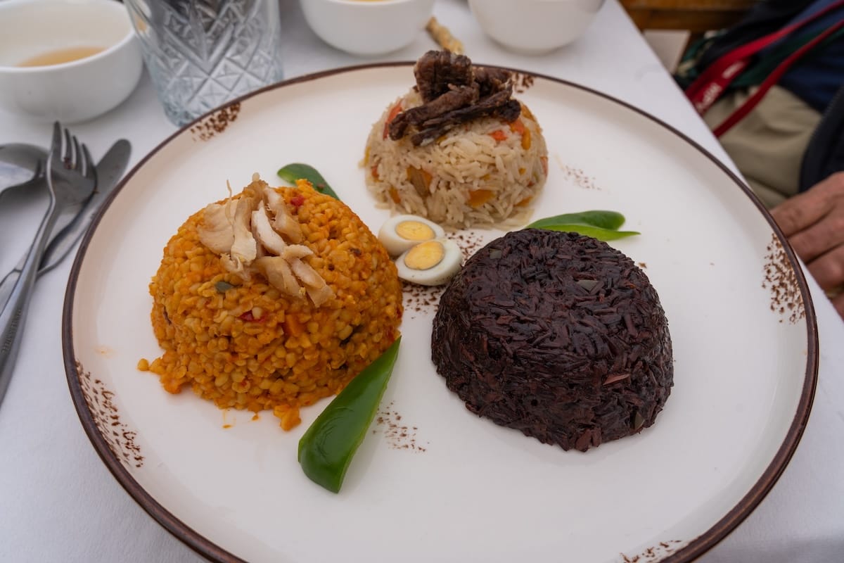 three scoops of different plovs on a plate