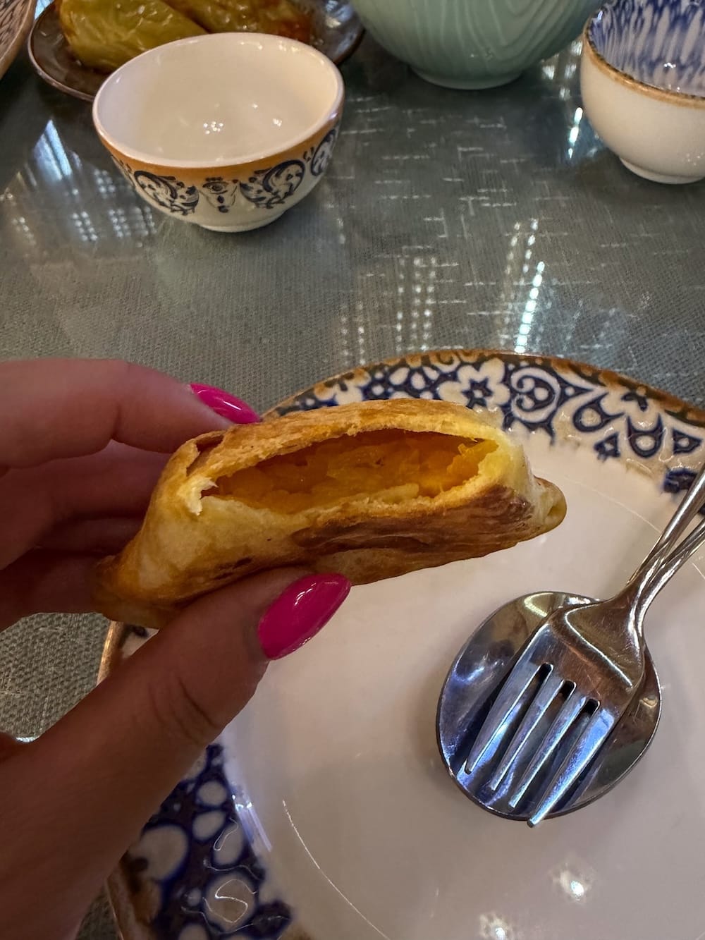 a pumpkin dumpling in a woman's hand