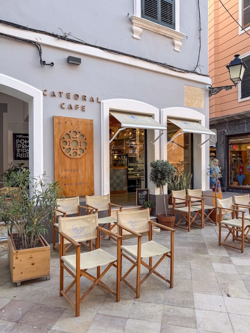 a blue exterior of a coffee shop in Spain
