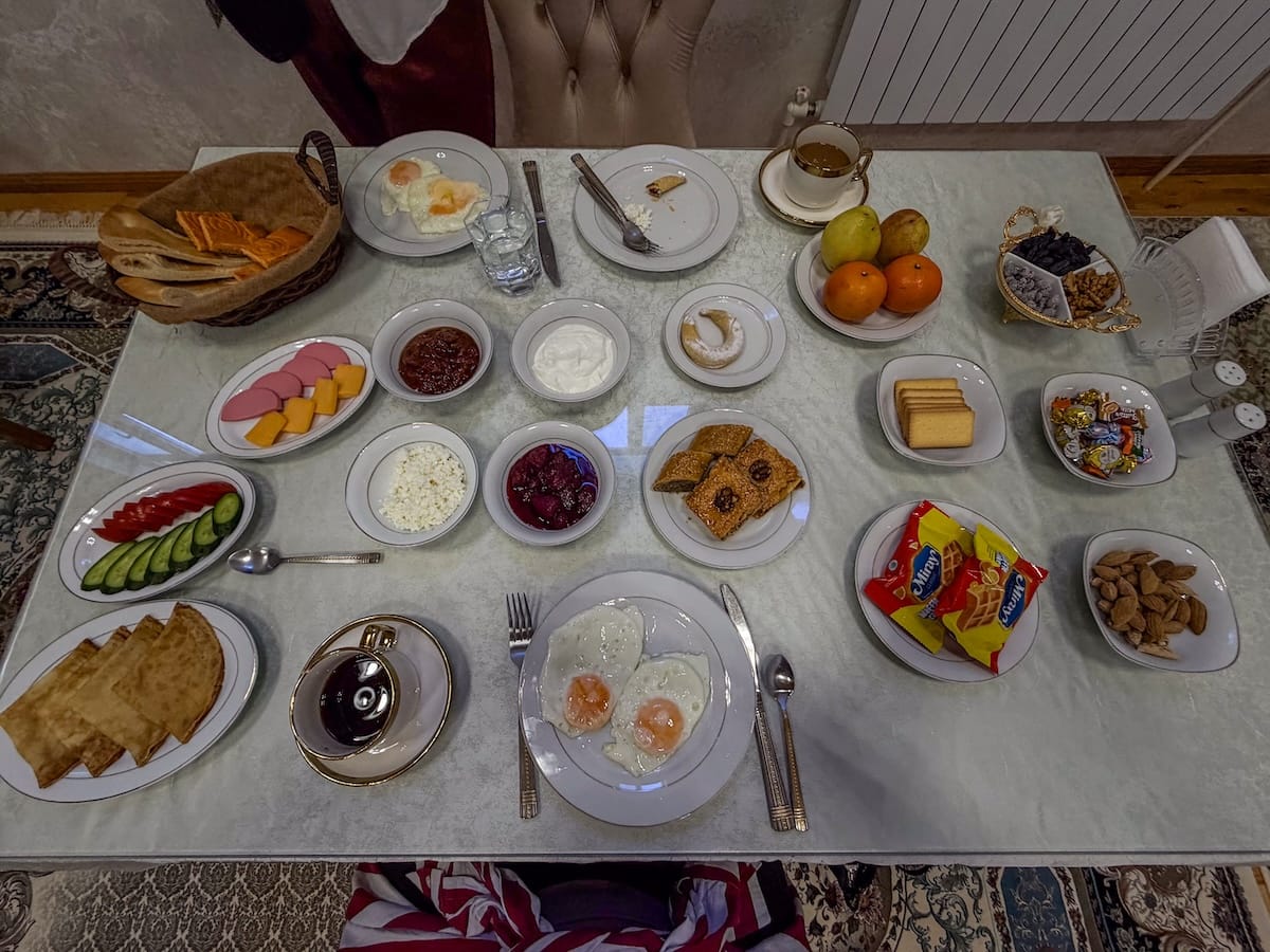a table with tons of breakfast items on it in uzbekistan