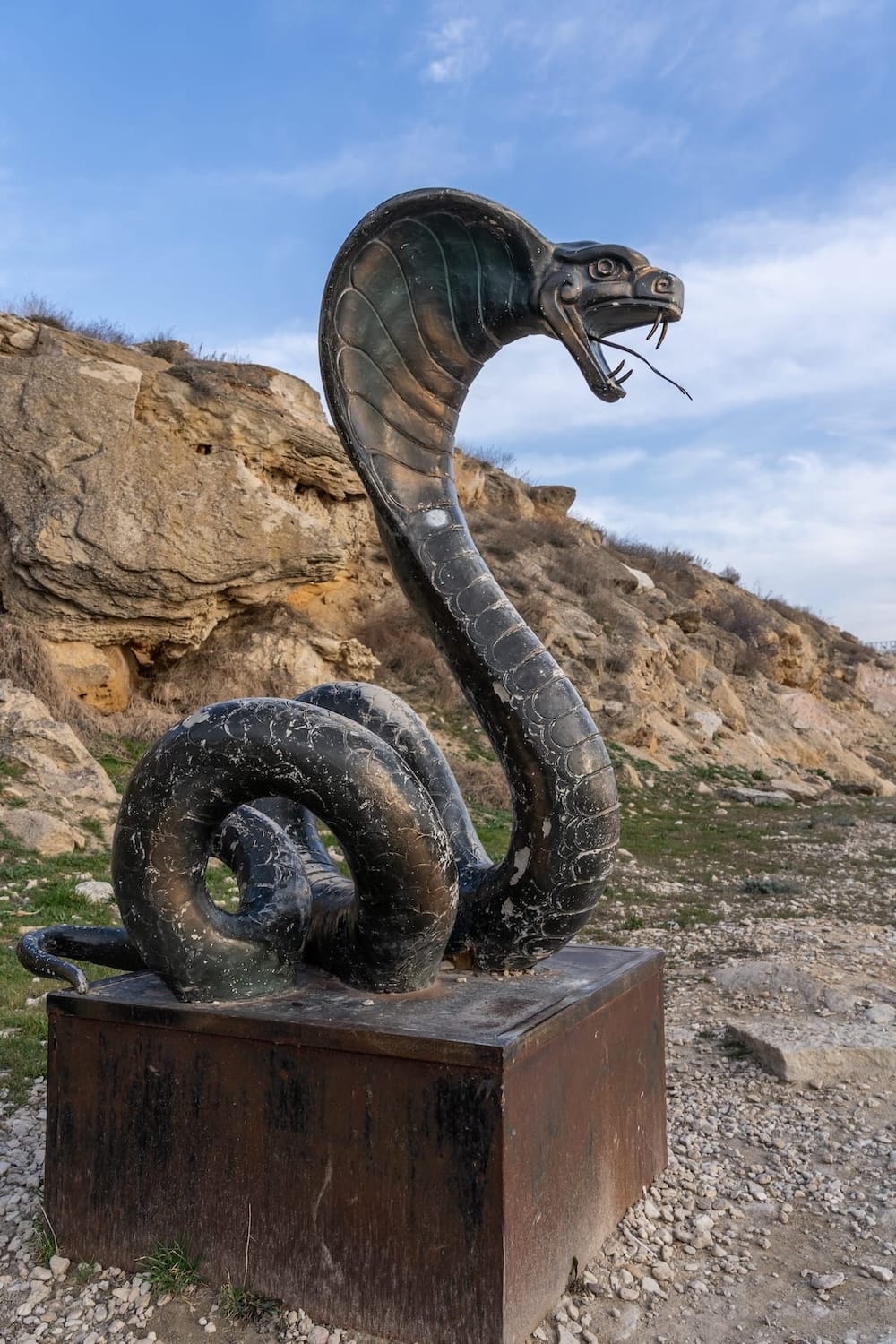 a statue of a snake on the caspian sea
