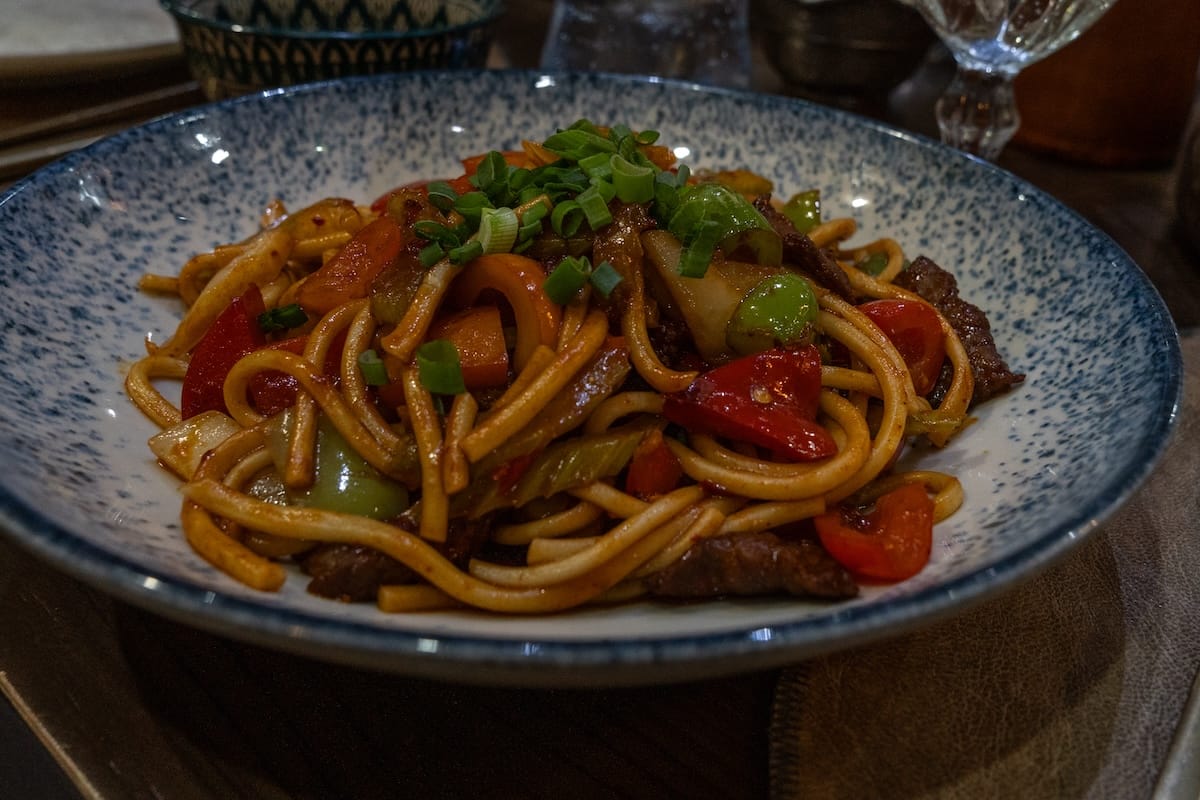 a plate of fried noodles at a restaurant in kazakhstan