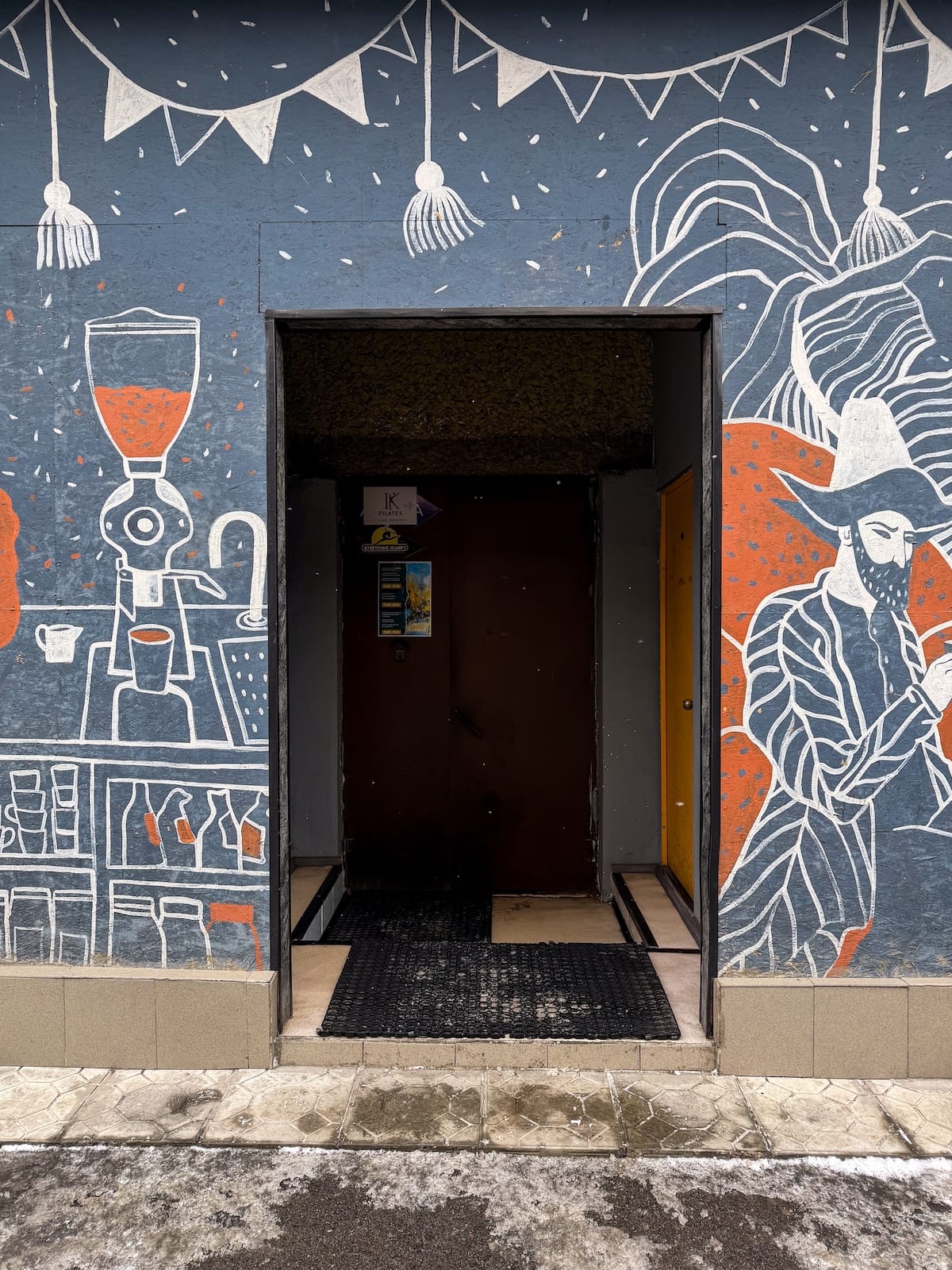 a mural on a coffee shop in almaty