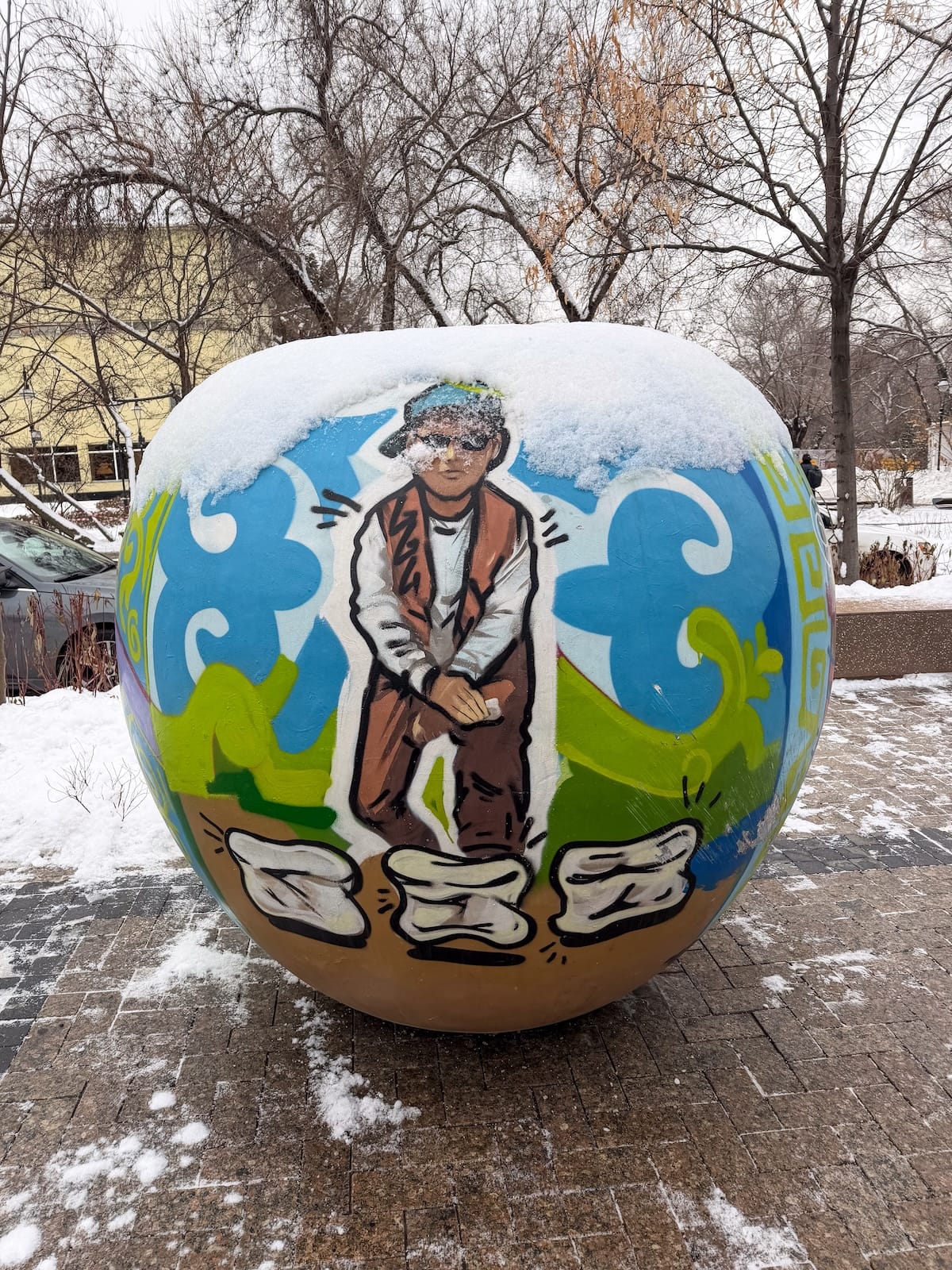 an apple with a mural on it in almaty