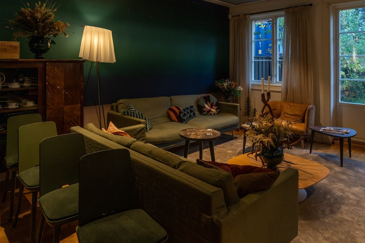 a dark room inside a restaurant with couches
