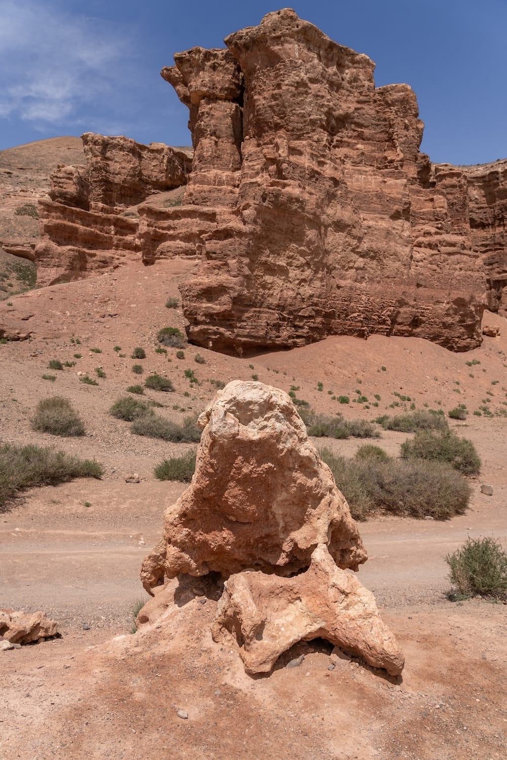 A desert canyon with large rock formations
