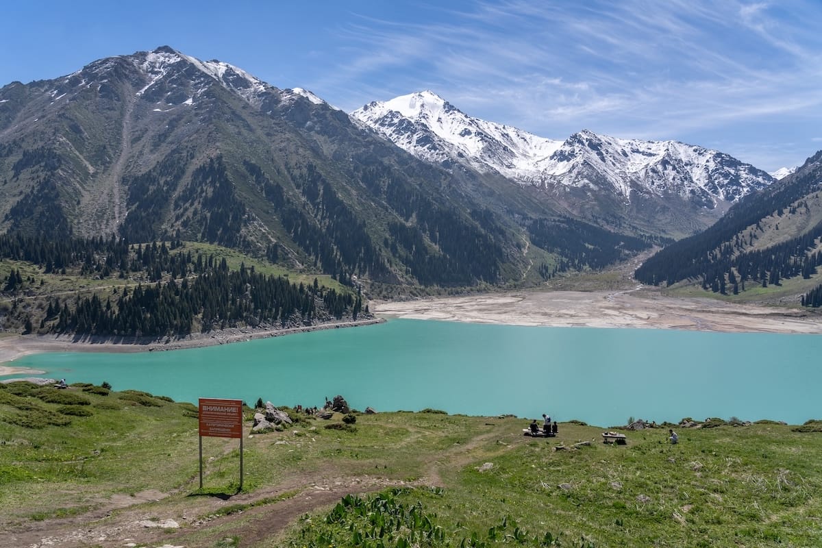 Is Almaty worth visiting? A breakdown of my thoughts...

a photo of a blue/teal mountain lake in central asia